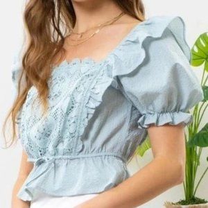 Blouse with front puff sleeve.